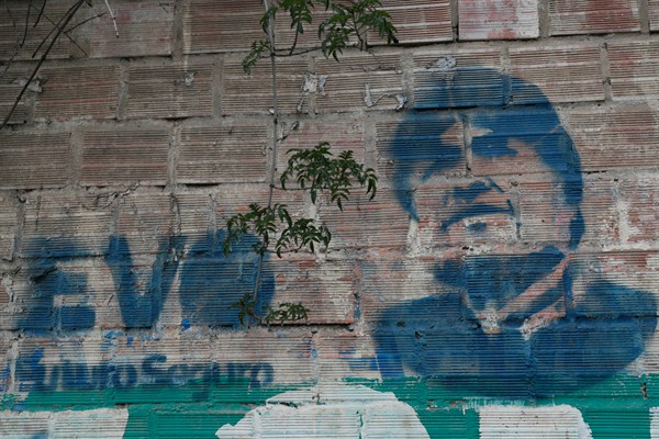 A stencil of former President Evo Morales adorns a wall in La Paz, Bolivia, Dec. 6, 2019 (AP photo by Juan Karita).