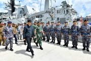Indonesian President Joko Widodo inspects troops at Selat Lampa Port, Natuna Islands, Indonesia (Indonesian Presidential Office photo via AP Images).