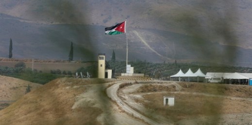 Soldiers stand guard in a watchtower flying Jordanian flags, in the area of ​​Baqoura near the Israeli-Jordanian border, Nov. 13, 2019 (AP photo by Raad Adayleh).