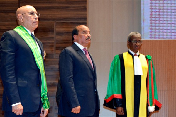 Mauritanian President Mohamed Ould Ghazouani, left, and his predecessor, Mohamed Ould Abdel Aziz, center, during Ould Ghazouani’s inauguration in Nouakchott, Mauritania, Aug. 1, 2019 (AP photo by Elhady Ould Mohamedou).