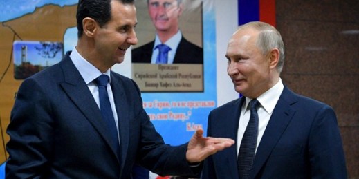 Syrian President Bashar al-Assad, left, speaks with Russian President Vladimir Putin during their meeting in Damascus, Jan. 7, 2020 (pool photo by Alexei Druzhinin of Sputnik via AP Images).