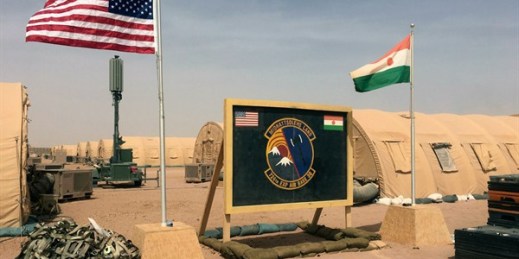 U.S. and Nigerien flags raised side by side at the base camp for air forces and other personnel supporting the construction of Niger Air Base 201 in Agadez, Niger, April 16, 2018 (AP photo by Carley Petesch).