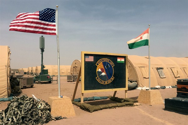 U.S. and Nigerien flags raised side by side at the base camp for air forces and other personnel supporting the construction of Niger Air Base 201 in Agadez, Niger, April 16, 2018 (AP photo by Carley Petesch).