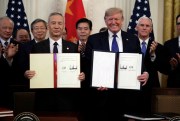 President Donald Trump and Chinese Vice Premier Liu He hold up the signed “phase one” trade deal in the East Room of the White House, Washington, Jan. 15, 2020 (AP photo by Evan Vucci).
