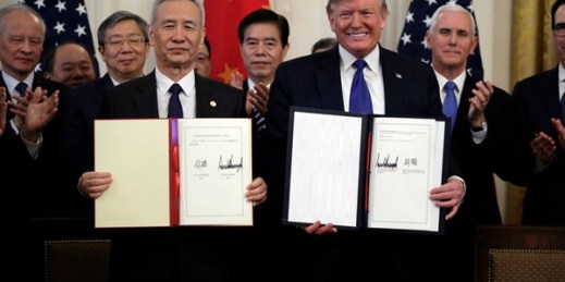 President Donald Trump and Chinese Vice Premier Liu He hold up the signed “phase one” trade deal in the East Room of the White House, Washington, Jan. 15, 2020 (AP photo by Evan Vucci).