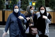 People wear masks to help guard against the Coronavirus in downtown Tehran, Iran, Feb. 23, 2020 (AP photo by Ebrahim Noroozi).
