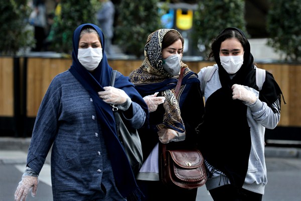 People wear masks to help guard against the Coronavirus in downtown Tehran, Iran, Feb. 23, 2020 (AP photo by Ebrahim Noroozi).