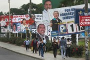Billboards featuring candidates for Congress line a street in the San Juan de Miraflores neighborhood of Lima, Peru, Jan. 23, 2020 (AP photo by Martin Mejia).