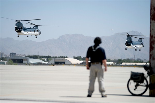 Helicopters with Secretary of State Mike Pompeo aboard take off at Camp Alvarado in Kabul, Afghanistan, July 9, 2018 (AP photo by Andrew Harnik).
