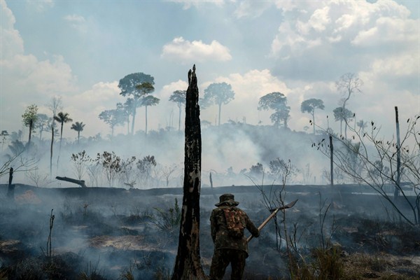 A Brazilian soldier puts out fires at the Nova Fronteira region in Novo Progresso, Brazil, Sept. 3, 2019 (AP photo by Leo Correa).