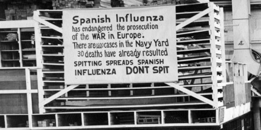 A sign at the Naval Aircraft Factory in Philadelphia warning of the spread of the “Spanish Influenza,” Oct. 19, 1918 (U.S. Naval History and Heritage Command photo via AP Images).