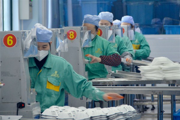 Face masks being manufactured at a factory in Shanghai, China, Jan. 31, 2020 (Kyodo photo via AP Images).