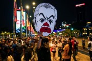 A protester holds a cut-out of the new prime minister, Muhyiddin Yassin, in Kuala Lumpur, Malaysia, Feb. 29, 2020 (AP photo by Vincent Thian).