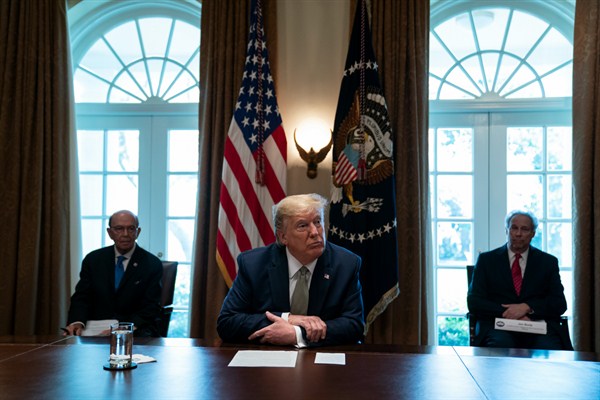 President Donald Trump listens during a meeting with tourism industry executives about the COVID-19 pandemic, at the White House, Washington, March 17, 2020 (AP photo by Evan Vucci).