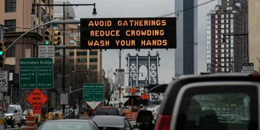 A sign urging commuters to avoid gatherings, reduce crowding and to wash hands in the Brooklyn borough of New York, March 19, 2020 (AP photo by Wong Maye-E).