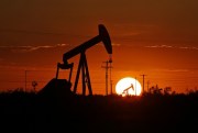 A pump jack operates in an oil field in the Permian Basin in Texas, June 11, 2019 (Photo by Jacob Ford for Odessa American via AP Images).