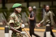 A member of the Kenya Youth Service wearing a cloth face mask, in Nairobi, Kenya, April 3, 2020 (AP photo by John Muchucha).