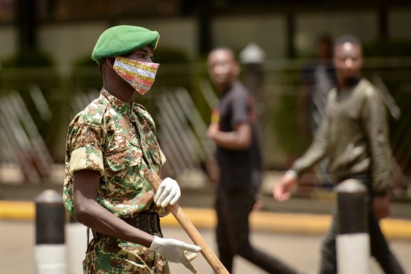 A member of the Kenya Youth Service wearing a cloth face mask, in Nairobi, Kenya, April 3, 2020 (AP photo by John Muchucha).