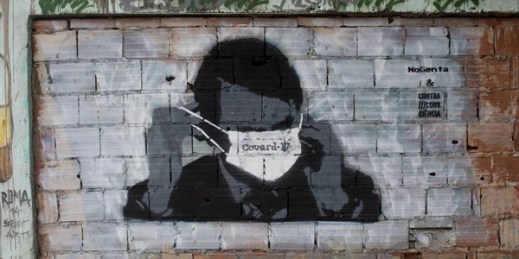 Graffiti of Brazilian President Jair Bolsonaro wearing a protective mask in Rio de Janeiro, April 7, 2020 (AP photo by Silvia Izquierdo).