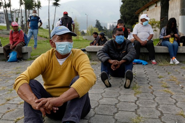 Homeless people wait in a park for help from the authorities during the coronavirus crisis in Quito, Ecuador, March 24, 2020 (Photo by Juan Diego Montenegro for dpa via AP Images).