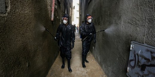 Palestinian health workers spray disinfectant in a residential area to try and limit the spread of the coronavirus, in Khan Yunis, Gaza Strip, April 9, 2020 (Photo by Yousef Masoud for Sipa via AP Images).