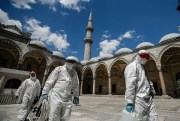 Municipality workers disinfect the grounds of the historical Suleymaniye Mosque, Istanbul, Turkey, May 26, 2020 (AP photo by Emrah Gurel).