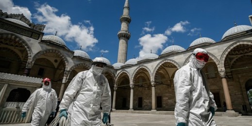 Municipality workers disinfect the grounds of the historical Suleymaniye Mosque, Istanbul, Turkey, May 26, 2020 (AP photo by Emrah Gurel).