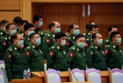Military representatives wear masks during a session of parliament, Naypyidaw, Myanmar, March 11, 2020 (AP photo by Aung Shine Oo).