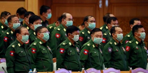 Military representatives wear masks during a session of parliament, Naypyidaw, Myanmar, March 11, 2020 (AP photo by Aung Shine Oo).