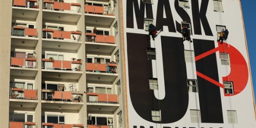 A billboard encouraging people to wear face masks is installed on an apartment building in Cape Town, South Africa, May 16, 2020 (AP photo by Nardus Engelbrecht).