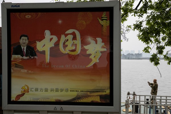 A government propaganda poster showing Chinese leader Xi Jinping and the words “China Dream” in Wuhan, China, April 2, 2020 (AP photo by Ng Han Guan).