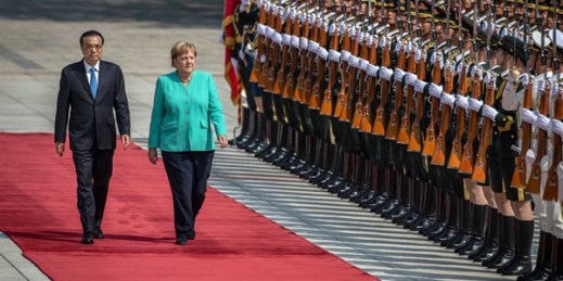 Chinese Premier Li Keqiang, left, and German Chancellor Angela Merkel inspect an honor guard during a welcome ceremony at the Great Hall of the People in Beijing, Sept. 6, 2019 (pool photo by Roman Pilipey via AP Images).