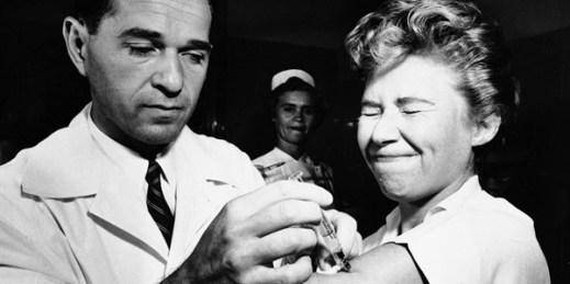 Dr. Joseph Ballinger gives Marjorie Hill, a nurse at Montefiore Hospital in New York, the first vaccine for the H2N2 virus to be administered in New York, Aug. 16, 1957 (AP photo).