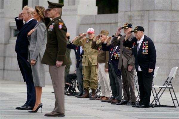 Veterans watch President Donald Trump and First Lady Melania Trump participate in a World War II commemoration in Washington, May 8, 2020 (AP photo by Evan Vucci).