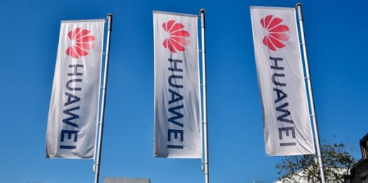 Flags with the logo of the Chinese telecommunications company Huawei in Bonn, Germany, April 6, 2020 (Photo by Horst Galuschka for dpa via AP Images).