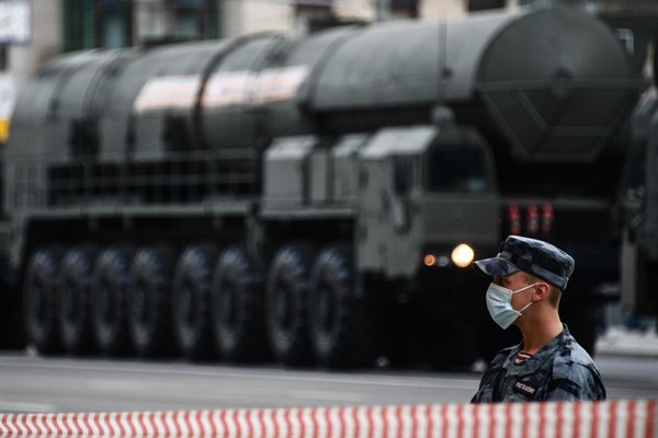 A Russian soldier stands guard near a Yars intercontinental ballistic missile system before a military parade, in central Moscow, May 9, 2020 (Sputnik photo by Evgeny Odinokov via AP).