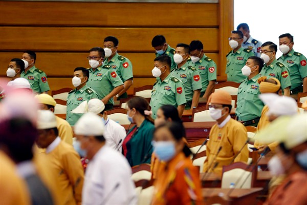Lawmakers wearing face masks to help curb the spread of the new coronavirus at the parliament building in Naypyidaw, Myanmar, June 1, 2020 (AP photo by Aung Shine Oo).
