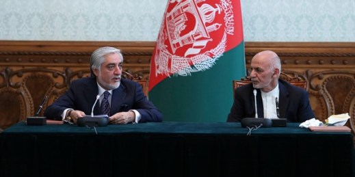 Afghan President Ashraf Ghani and his political rival, Abdullah Abdullah, after signing a power-sharing agreement in Kabul, Afghanistan, May 17, 2020 (Photo by Afghan Presidential Palace via AP Images).