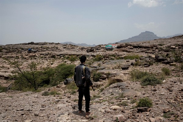 A fighter from a militia funded by the United Arab Emirates, stands on the frontline of conflict in Yemen’s Dhale province, Aug. 5, 2019 (AP photo by Nariman El-Mofty). Internationalized civil conflicts increase the chances of war between states.