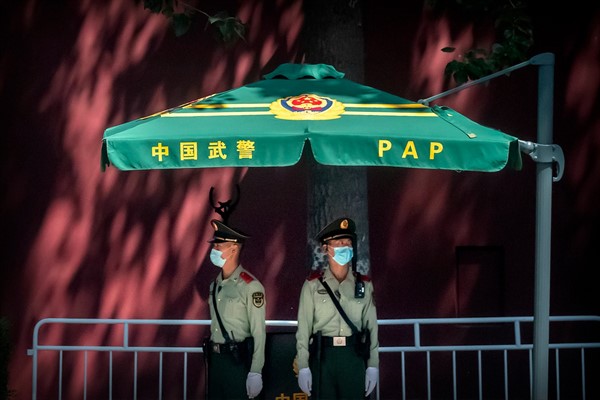 Chinese paramilitary police stand guard near Tiananmen Square and the Great Hall of the People in Beijing, May 20, 2020 (AP photo by Mark Schiefelbein).