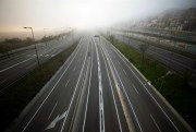 The highway leading to Barcelona is empty of cars amid the coronavirus pandemic, March 15, 2020 (AP photo by Emilio Morenatti).