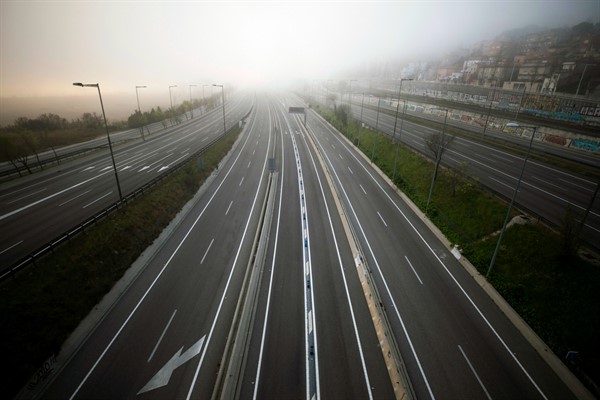 The highway leading to Barcelona is empty of cars amid the coronavirus pandemic, March 15, 2020 (AP photo by Emilio Morenatti).