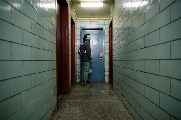 A medical officer makes her rounds treating psychiatric patients in a public housing complex in Brooklyn, New York, May 6, 2020 (AP photo by John Minchillo).