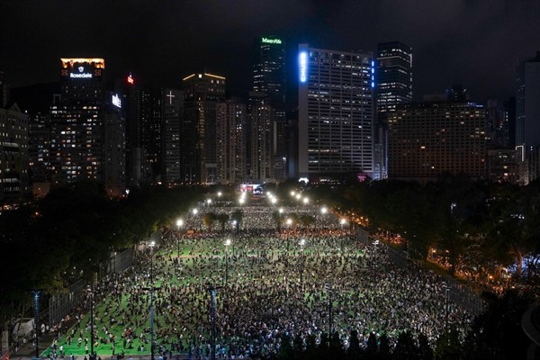 People gather for a vigil to remember the victims of the 1989 Tiananmen Square Massacre, despite permission for it being officially denied, in Hong Kong, June 4, 2020 (AP photo by Vincent Yu).