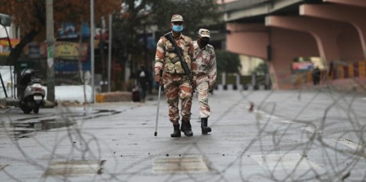 Security officers keep guard during lockdown in Jammu, India, March 27, 2020 (AP photo by Channi Anand).