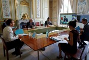 French President Emmanuel Macron speaks with G-7 leaders during a videoconference on the coronavirus pandemic, at the Elysee Palace in Paris, April 16, 2020 (pool photo by Gonzalo Fuentes via AP Images).