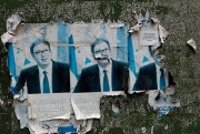 Remains of posters of Serbian President Aleksandar Vucic on a wall in an ethnic Serb-dominated part of Mitrovica, Kosovo, Oct. 6, 2019 (AP photo by Darko Vojinovic).