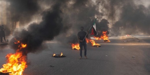 Tires burn during a demonstration to commemorate the first anniversary of a deadly crackdown carried out by security forces on protesters, in Khartoum, Sudan, June 3, 2020 (AP photo by Marwan Ali).