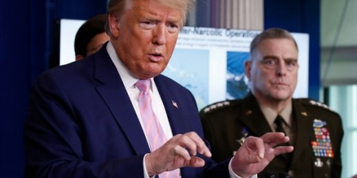 President Donald Trump speaks about the coronavirus as Chairman of the Joint Chiefs of Staff Gen. Mark Milley listens, at the White House, Washington, April 1, 2020 (AP photo by Alex Brandon).