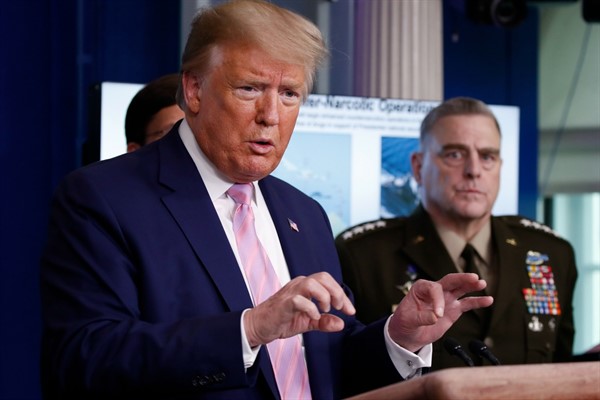 President Donald Trump speaks about the coronavirus as Chairman of the Joint Chiefs of Staff Gen. Mark Milley listens, at the White House, Washington, April 1, 2020 (AP photo by Alex Brandon).